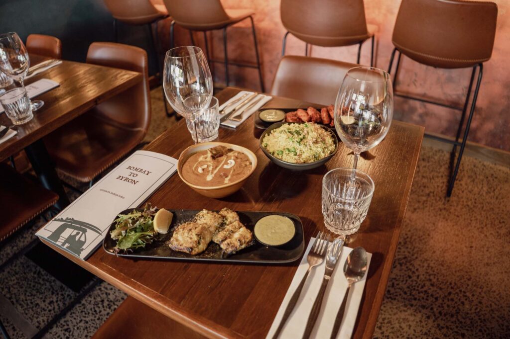 Indian food on the table of Bombay to Byron. A modern indian restaurant nestled in the heart of Byron Bay, available for dine in, takeaway or delivery